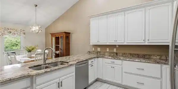 Image 4: Remodeled kitchen with new cabinets and granite co