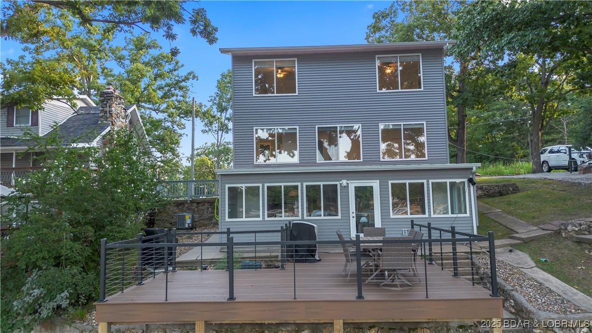 Image 1: Lake Front Side of Home with new composite deck