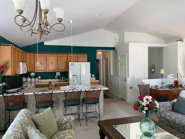 Image 3: The kitchen area opens up into the main living and