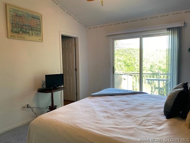 Image 4: The primary suite is bright, has a lake view, larg