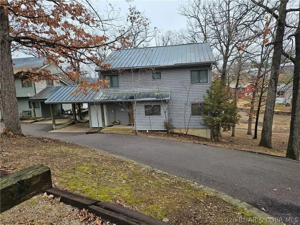 Image 1: Roadside view of townhouse