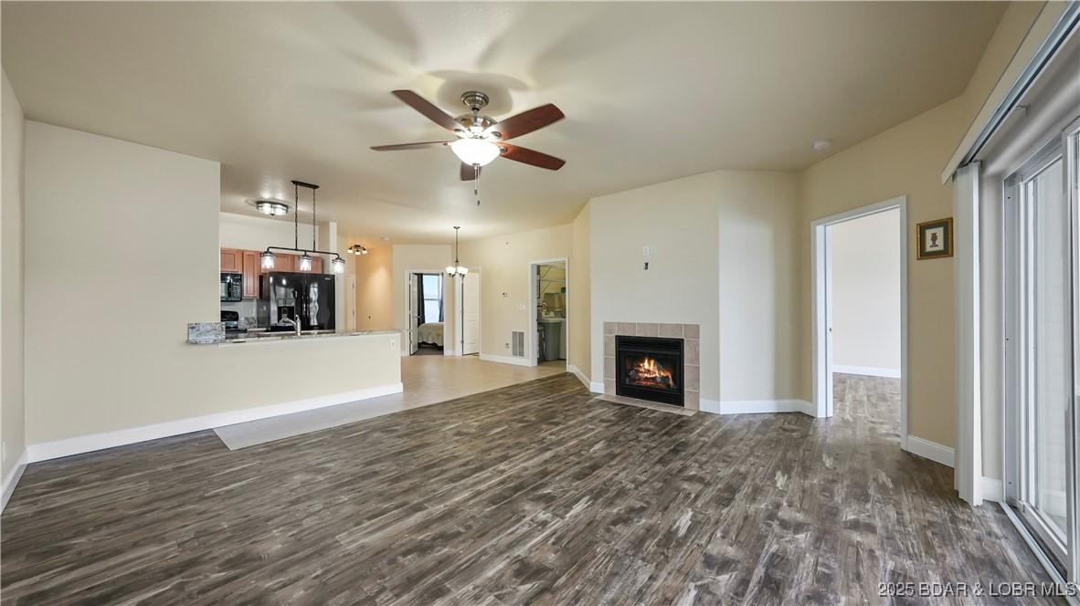 Image 3: Electric fireplace warms the living area
