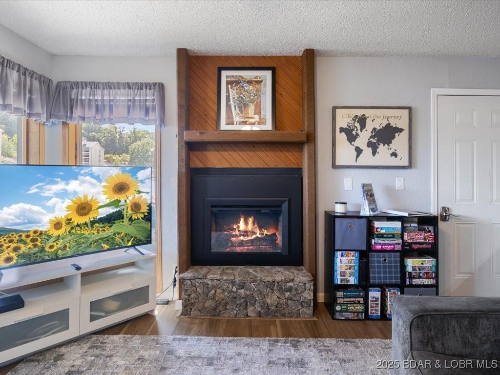 Image 1: Cozy & Inviting Living Room Featuring Electric Fir