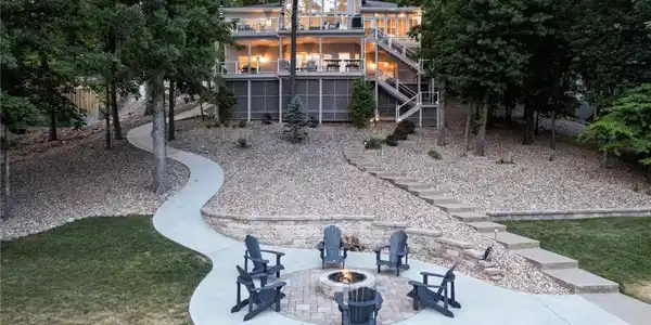Image 3: The lakeside has a large backyard, patio with fire