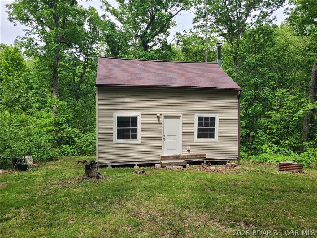 Image 1: Welcome to 5+ wooded acres and rustic cabin!