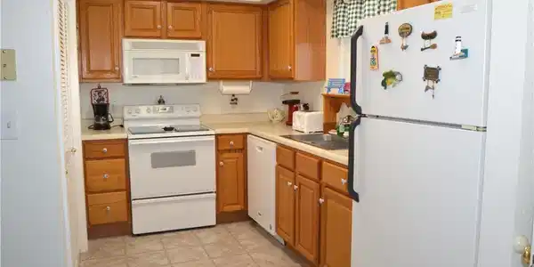 Image 3: Open kitchen with window view of lake