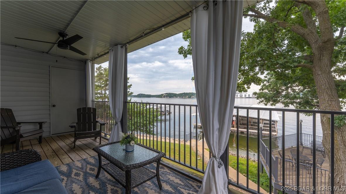 Image 2: Large Deck with Lake and Pool Views
