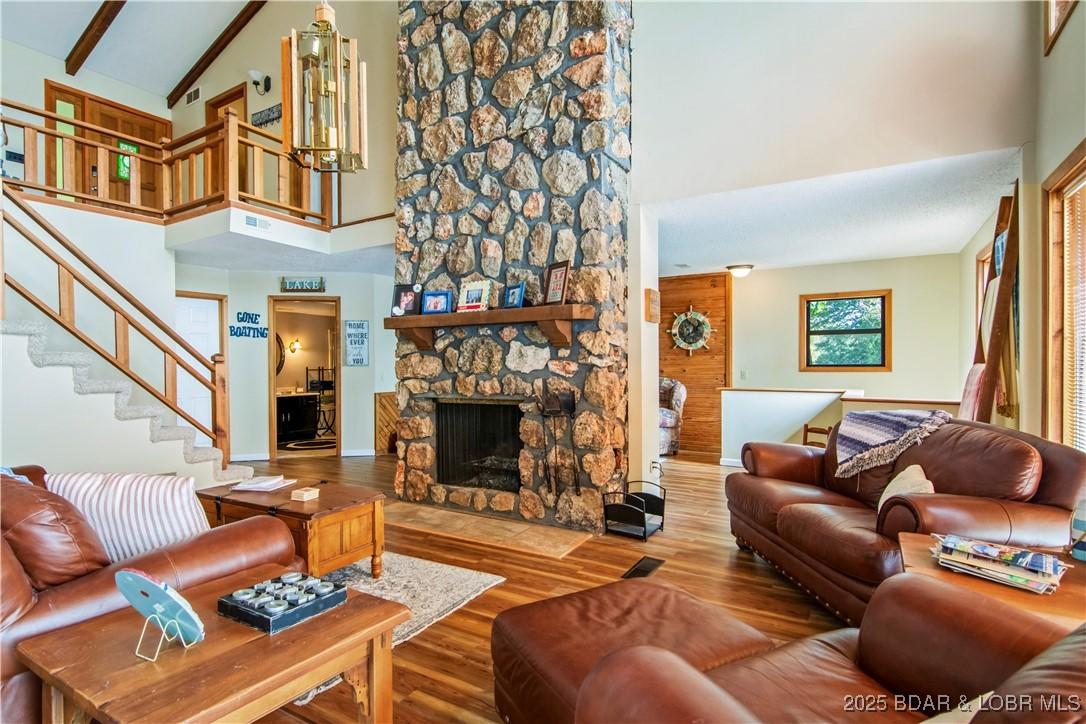 Image 2: Main level living room. The centered fireplace off
