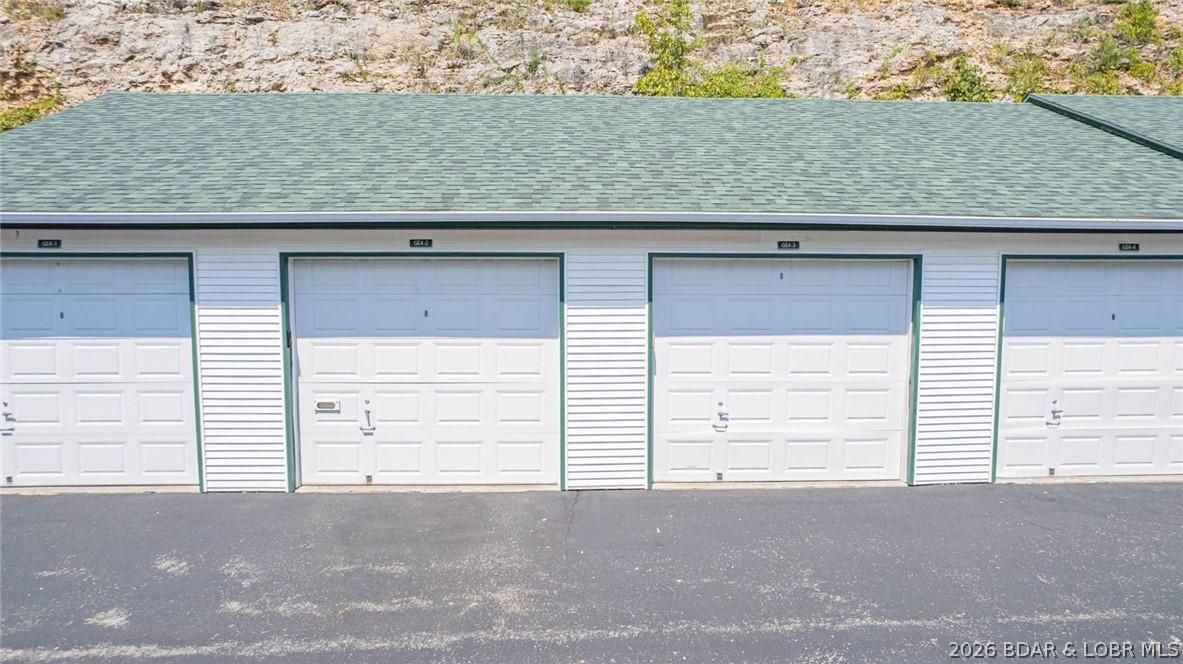 Image 3: Two garages available for additional funds right b