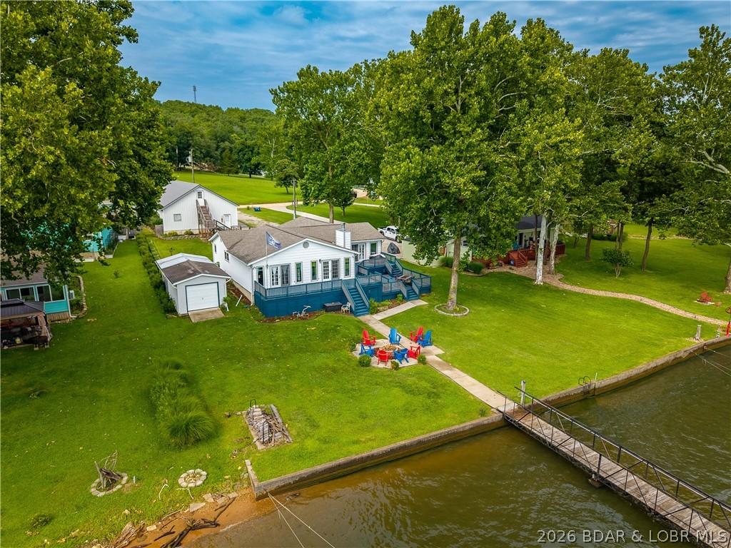 Image 1: 4 bedroom 3 bath home with 6 car garage spaces