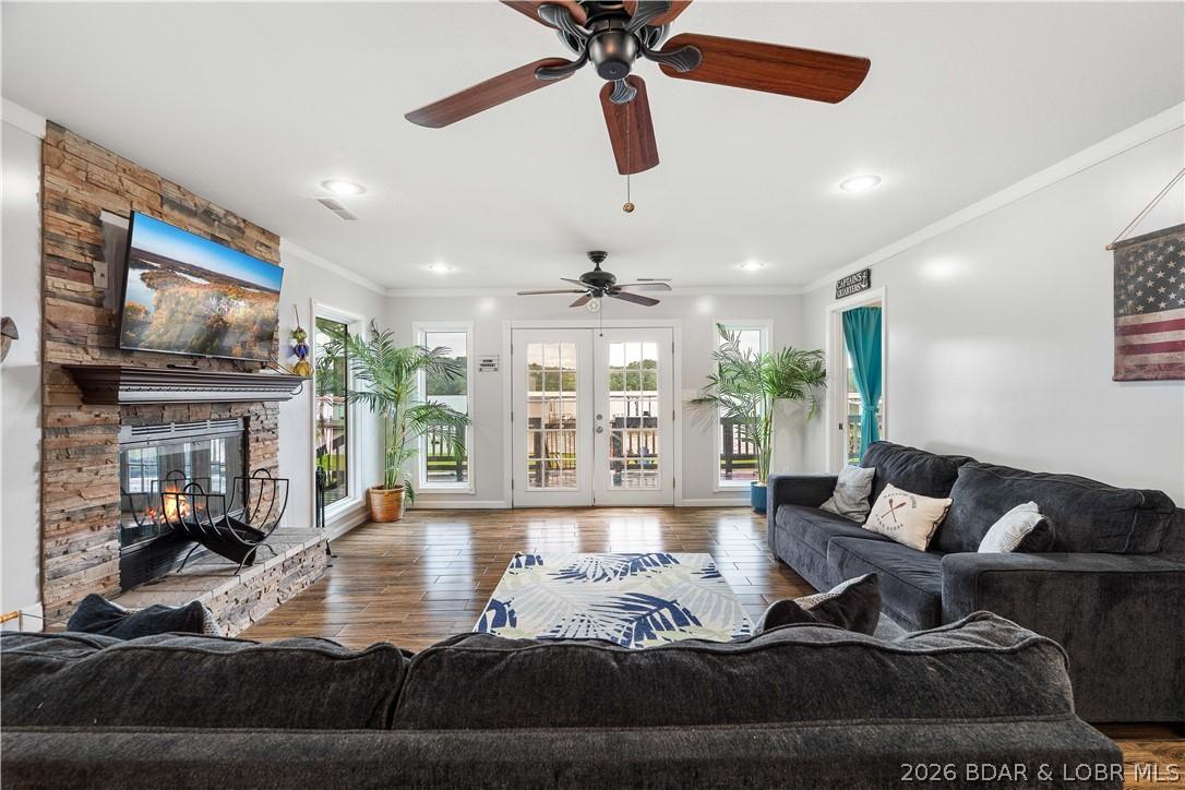 Image 3: Living room with french doors that lead to the dec