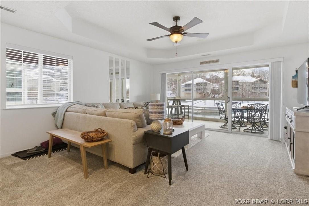 Image 2: Open-concept living room designed for comfort, wit
