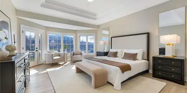 Image 4: Spacious master suite with easy access to upper de