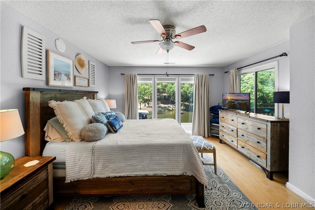 Image 3: Master Bedroom with lots of natural light & lake v