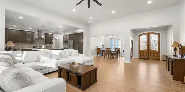 Image 3: Large living room with soaring ceilings.