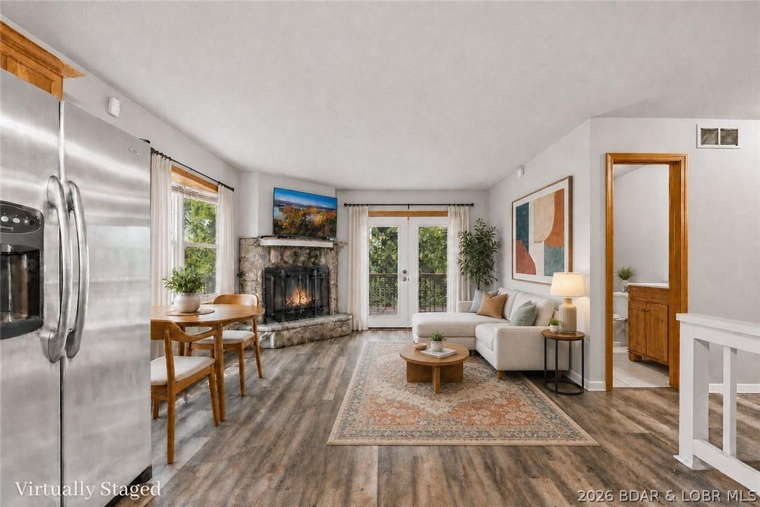 Image 3: This upstairs open concept floor plan has a wood b
