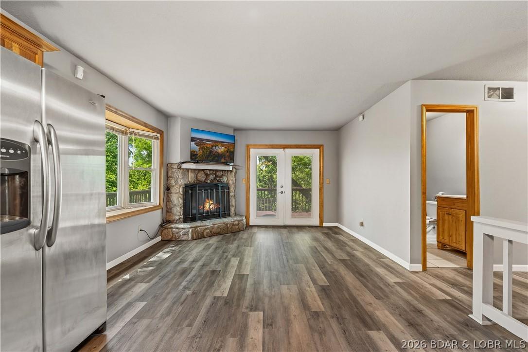 Image 4: This upstairs open concept floor plan has a wood b