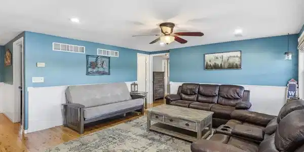 Image 4: The coastal blue walls, white waincotting and wood