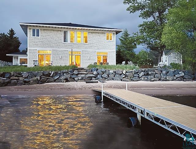 Image 0: Rear view of house with a water view, Back Of Structure