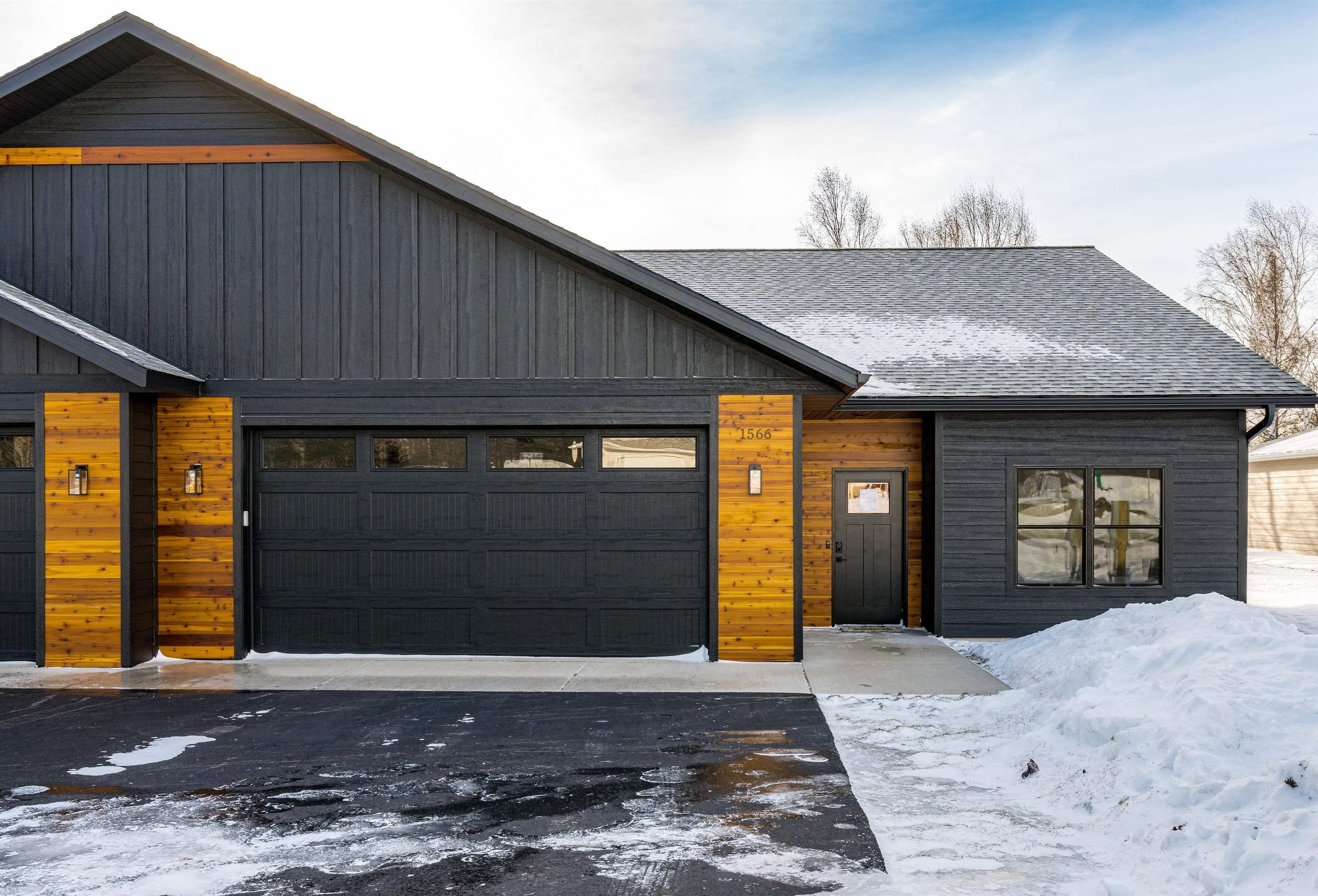 Image 0: Contemporary home with roof with shingles and a garage, Front Of Structure