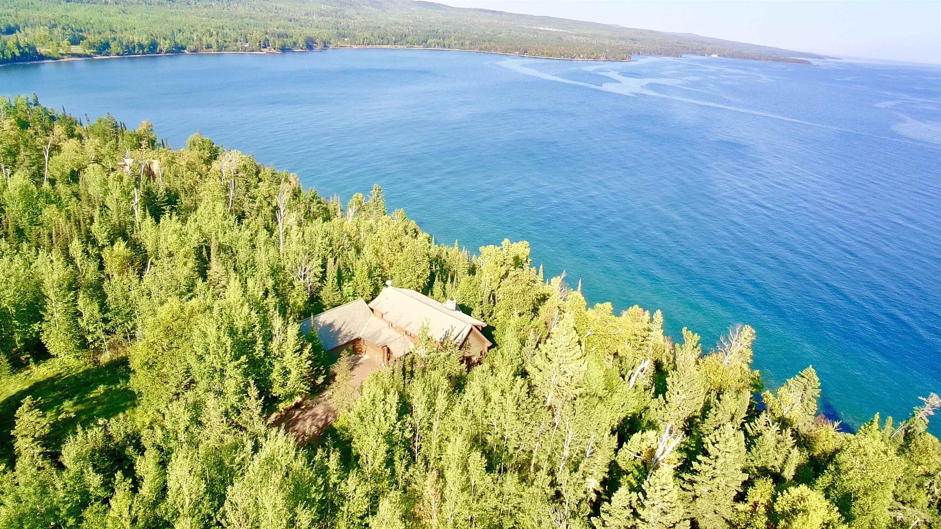 Image 3: Aerial view of Lake Superior and a heavily wooded area, Aerial View