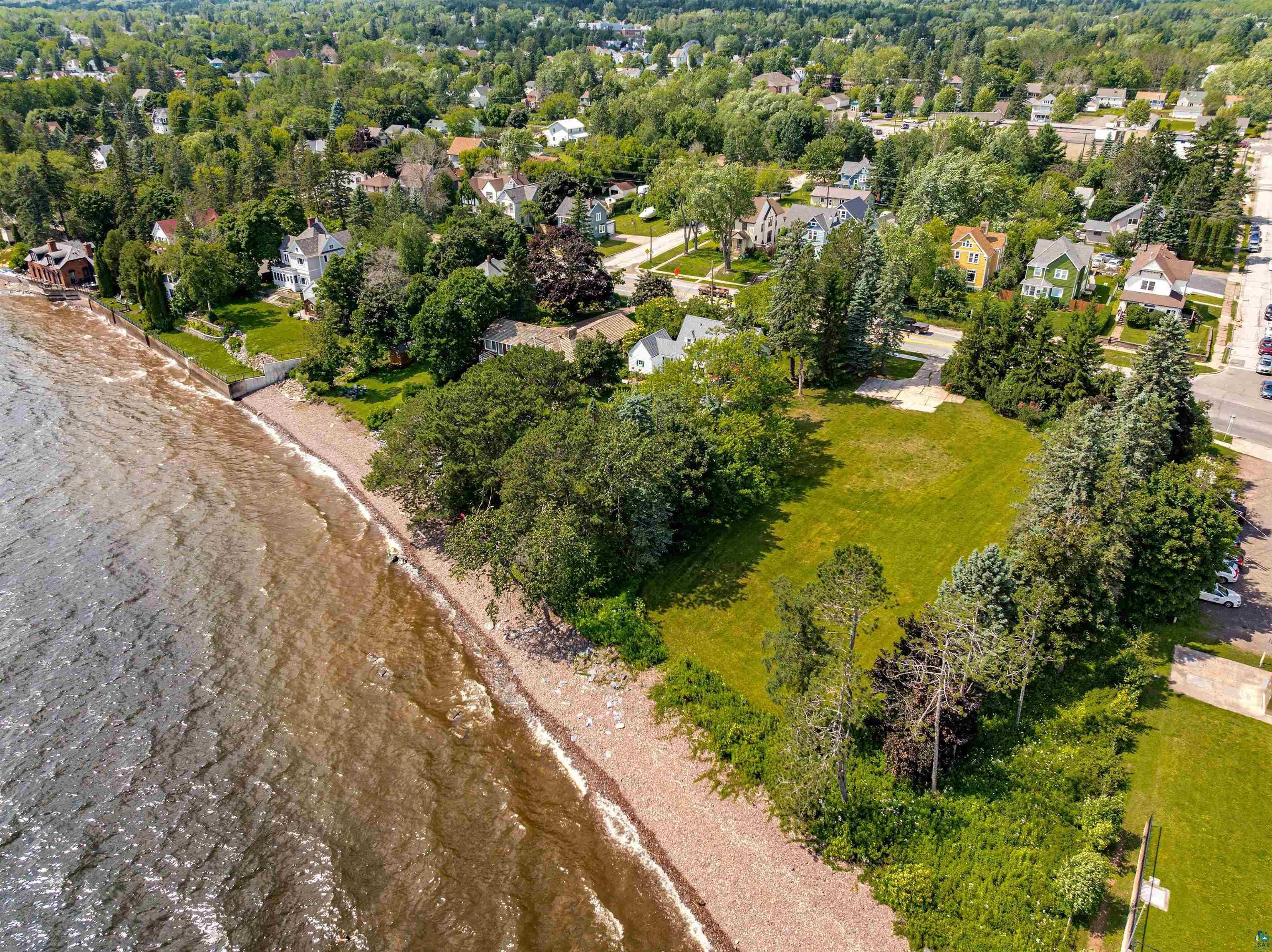 Image 1: Aerial view of property and surrounding area featuring nearby suburban area, Aerial View