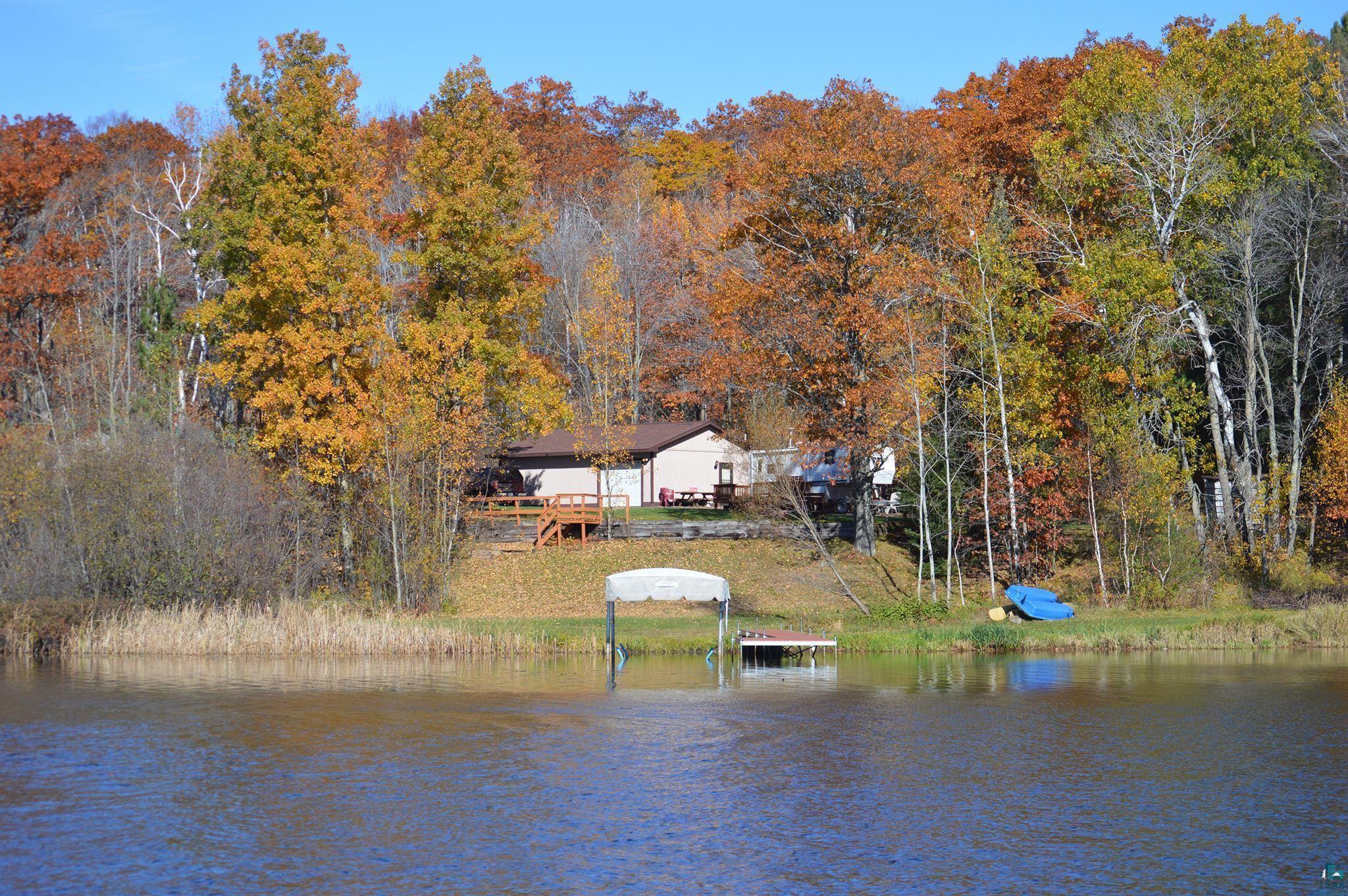 Image 0: Waterfront property with a private dock featuring a boat lift, Dock