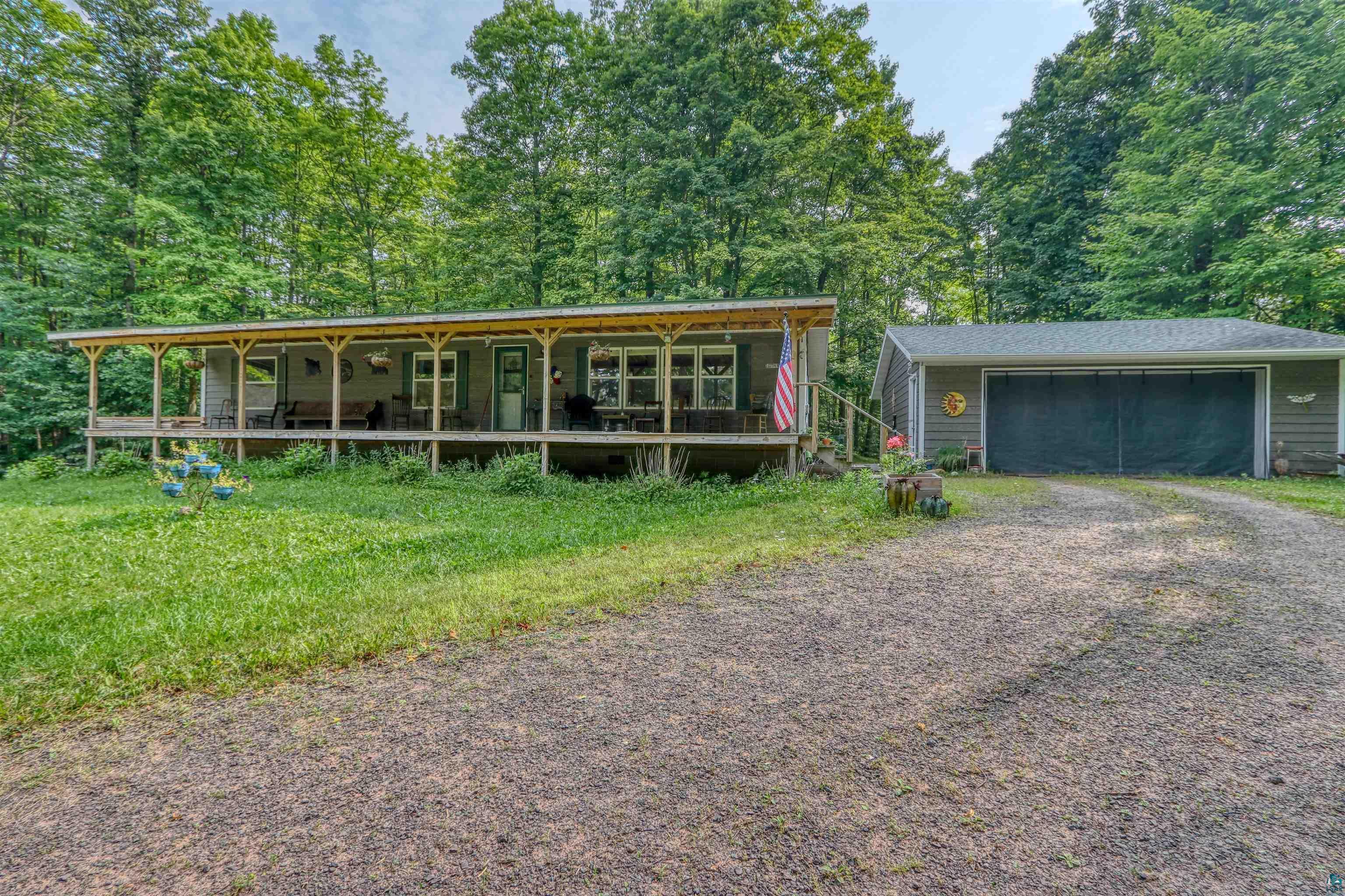 Image 0: View of front of home featuring a porch and an outbuilding, Front Of Structure