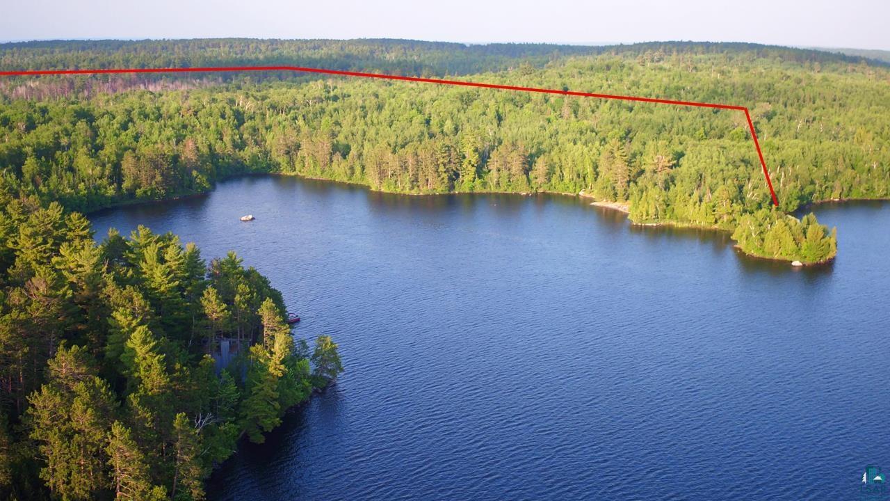 Image 2: Aerial overview of property's location with a nearby body of water and property boundaries highlighted, Aerial View