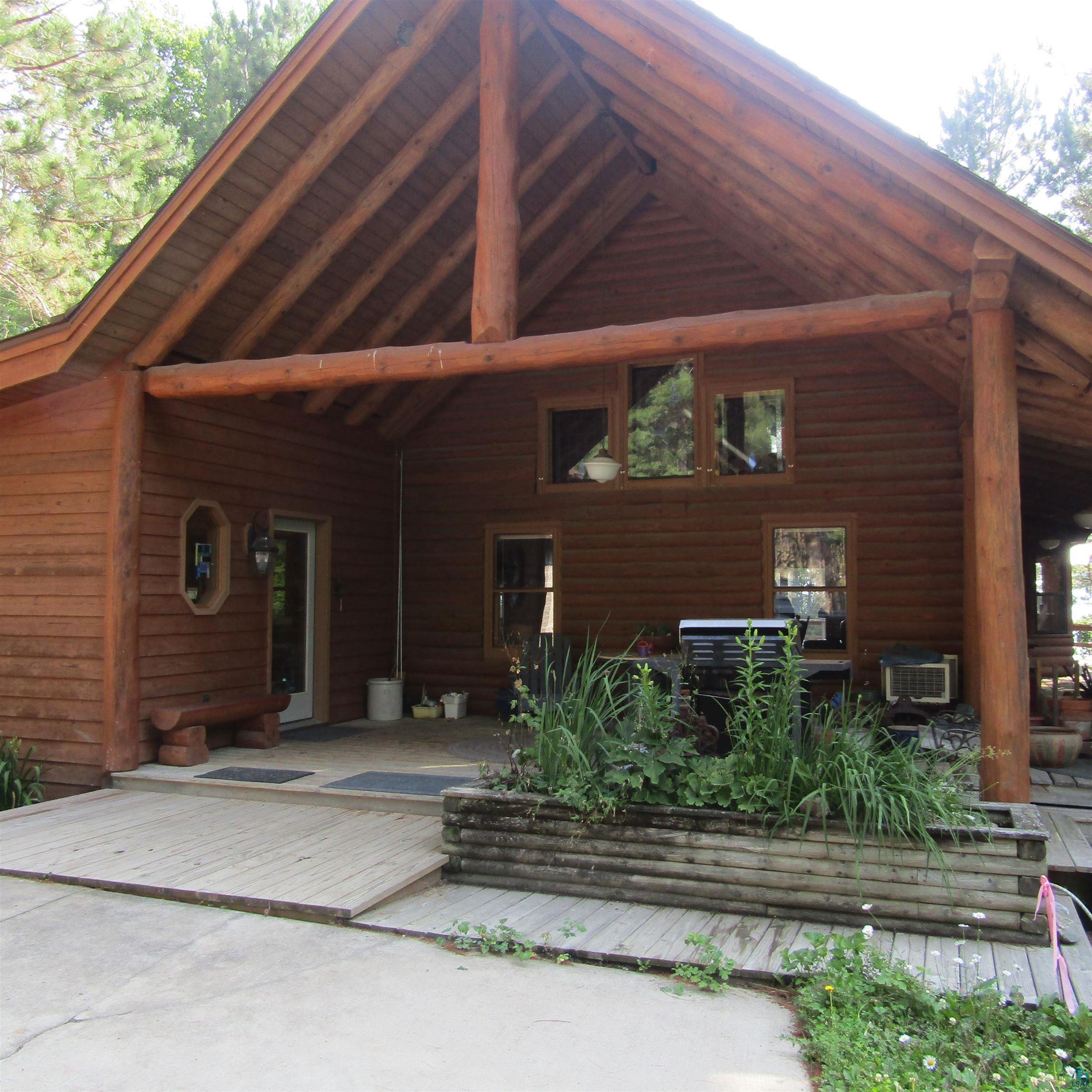 Image 1: Back of house with a patio, Back Of Structure