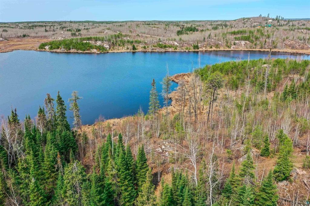 Image 3: Water view with a heavily wooded area, View