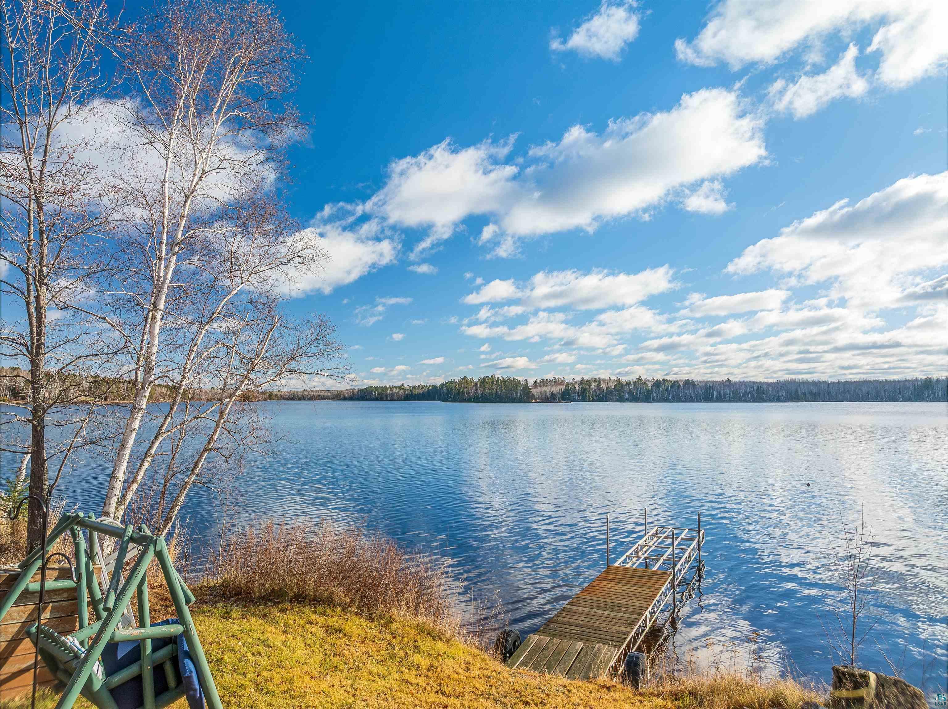 Image 1: Dock area featuring a water view, Dock