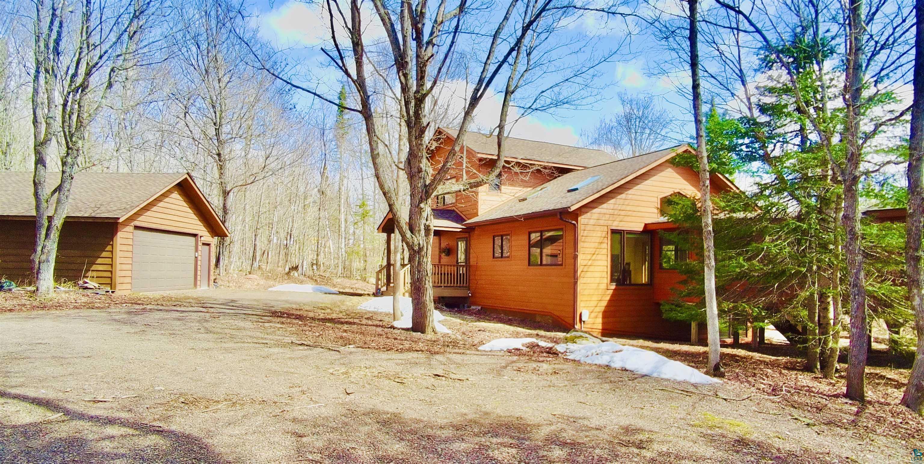 Image 3: Surrounded by Maples and other pine trees, Garage and Home