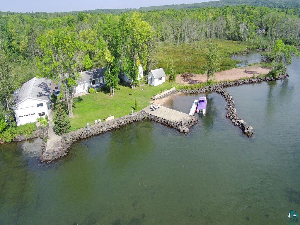 Image 0: Aerial view of a nearby body of water and a heavily wooded area, Aerial View
