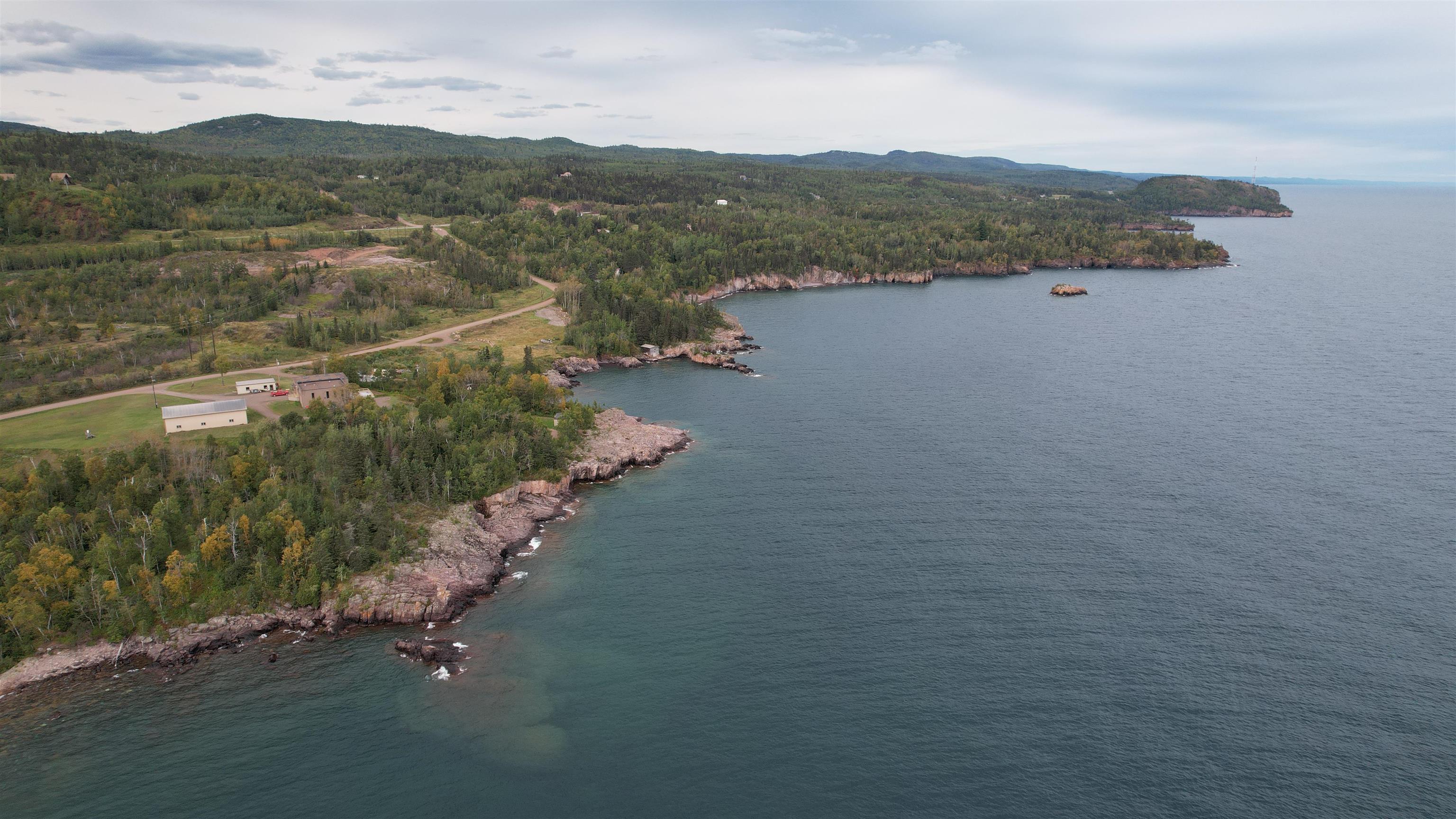 Image 2: Bird's eye view of a water and mountain view and a heavily wooded area, Aerial View