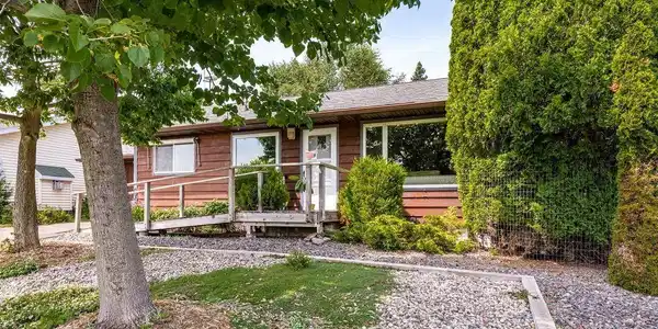 Image 1: Ranch-style exterior with wood siding & a gabled roof., Main flr living on Scenic Lk. Superior
