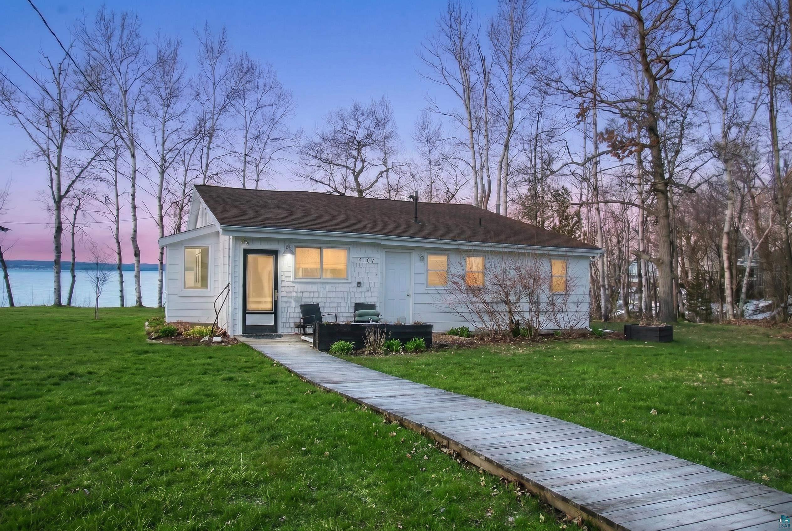 Image 0: View of front facade with a lawn, Front Of Structure