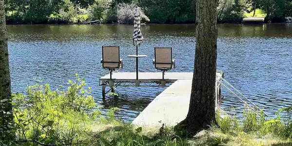 Image 1: Waterfront floating dock with access to a serene Caribou Lake, Dock