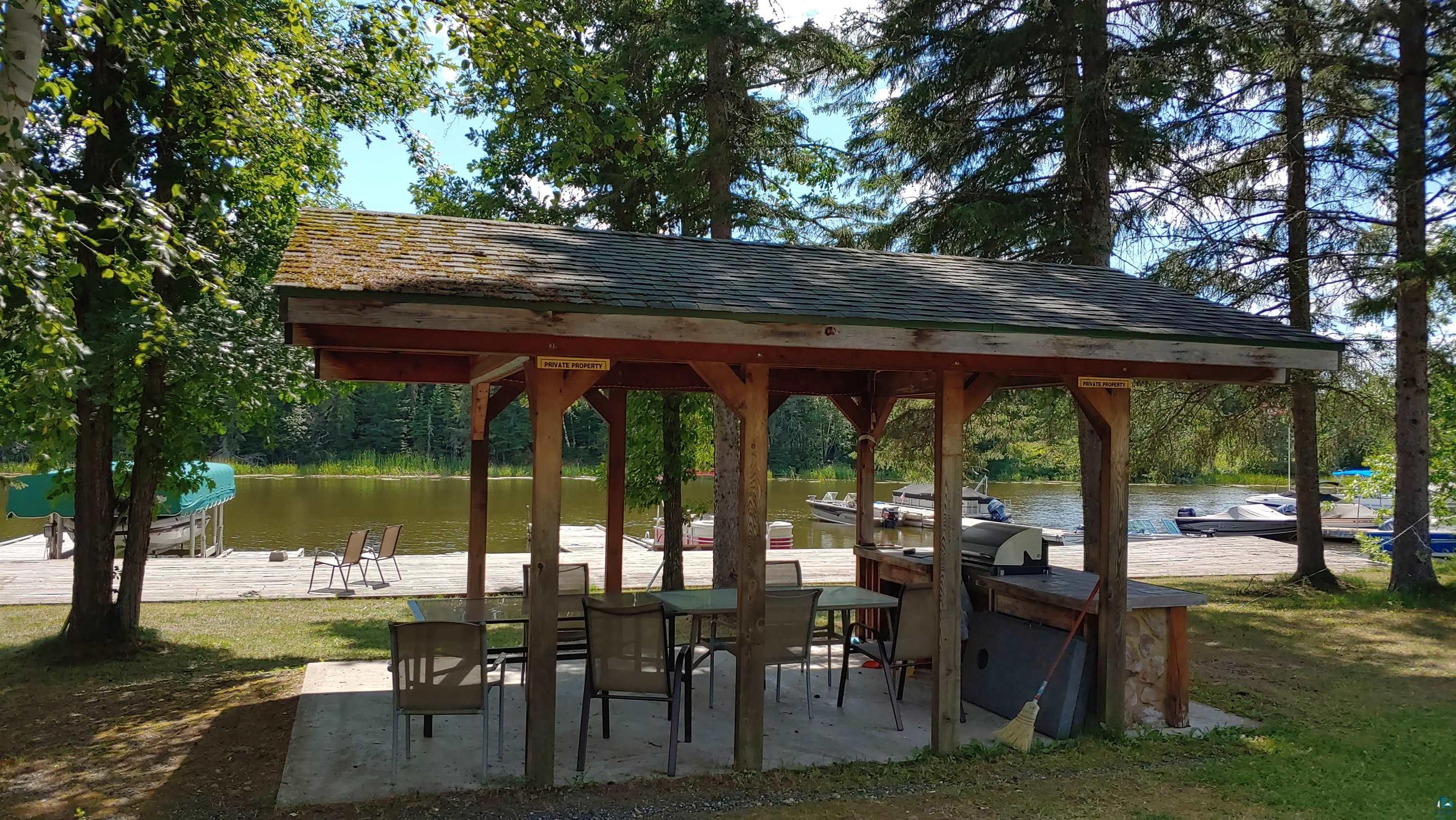 Image 2: View of property's community with a water view and a patio, Community