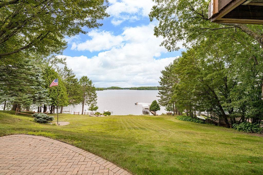 Image 2: View of green lawn with a water view, Yard