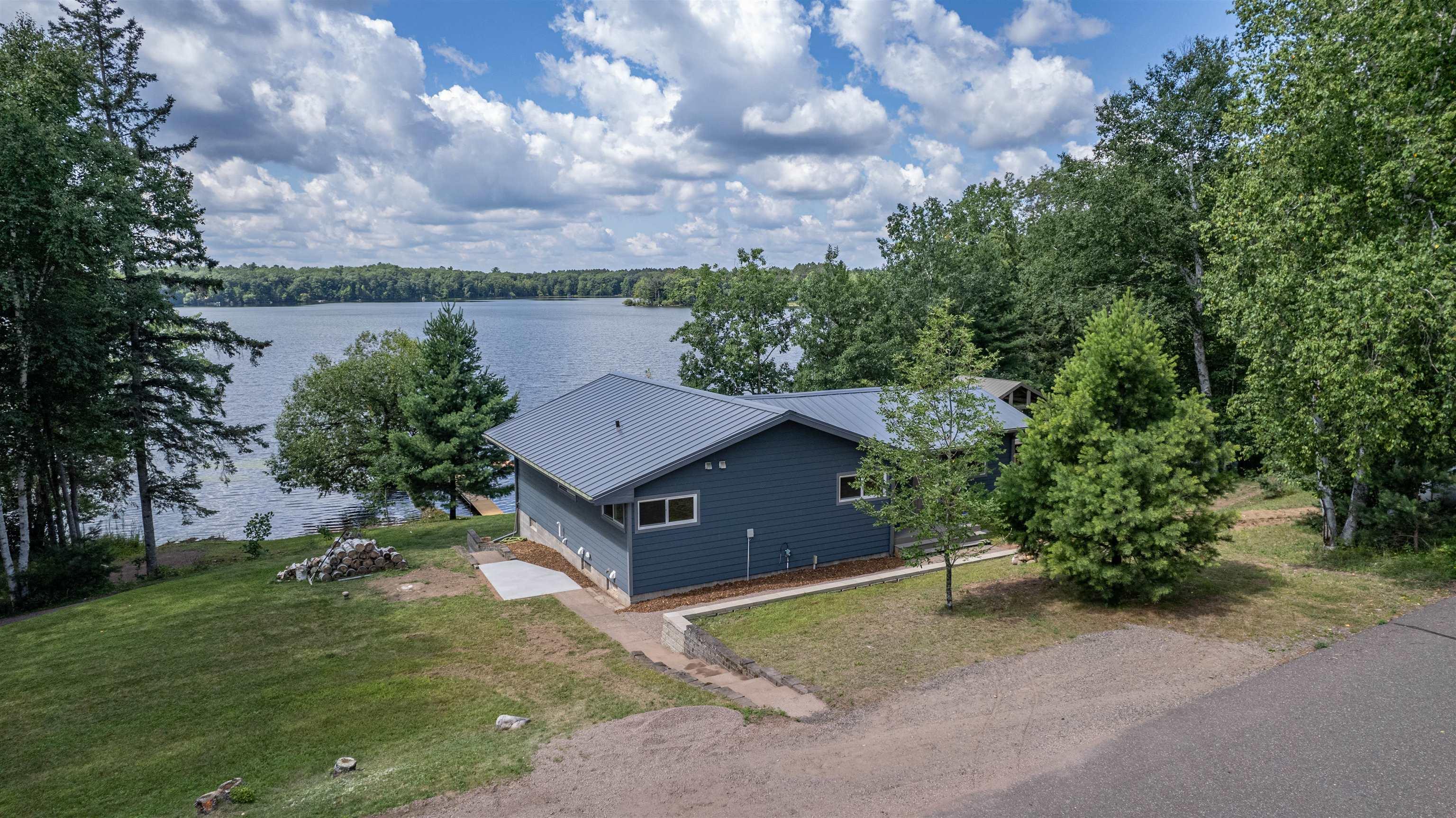 Image 0: View of subject property with a nearby body of water, Aerial View