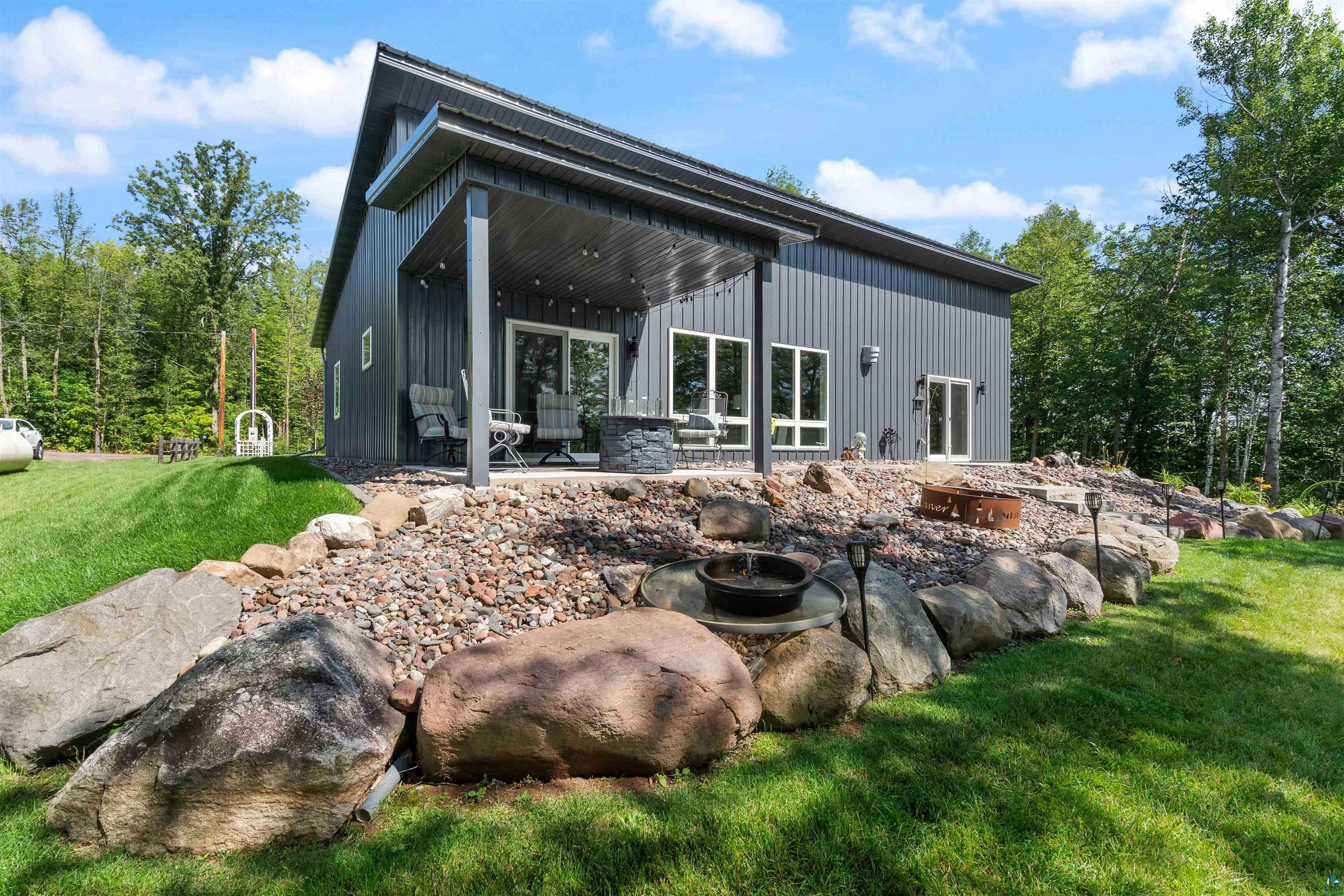 Image 0: Rear view of property with a patio area and a yard, Back Of Structure
