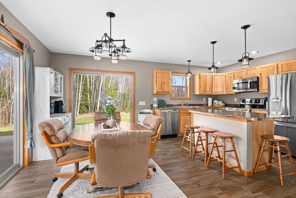 Image 3: Dining room featuring a chandelier, dark wood-style flooring, and recessed lighting, Dining Area