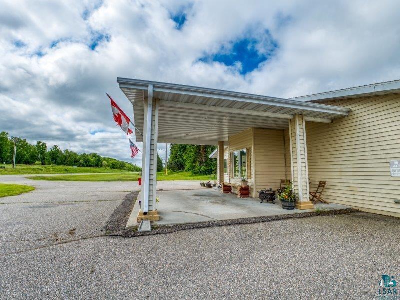 Image 3: View of parking featuring a carport and driveway, Parking
