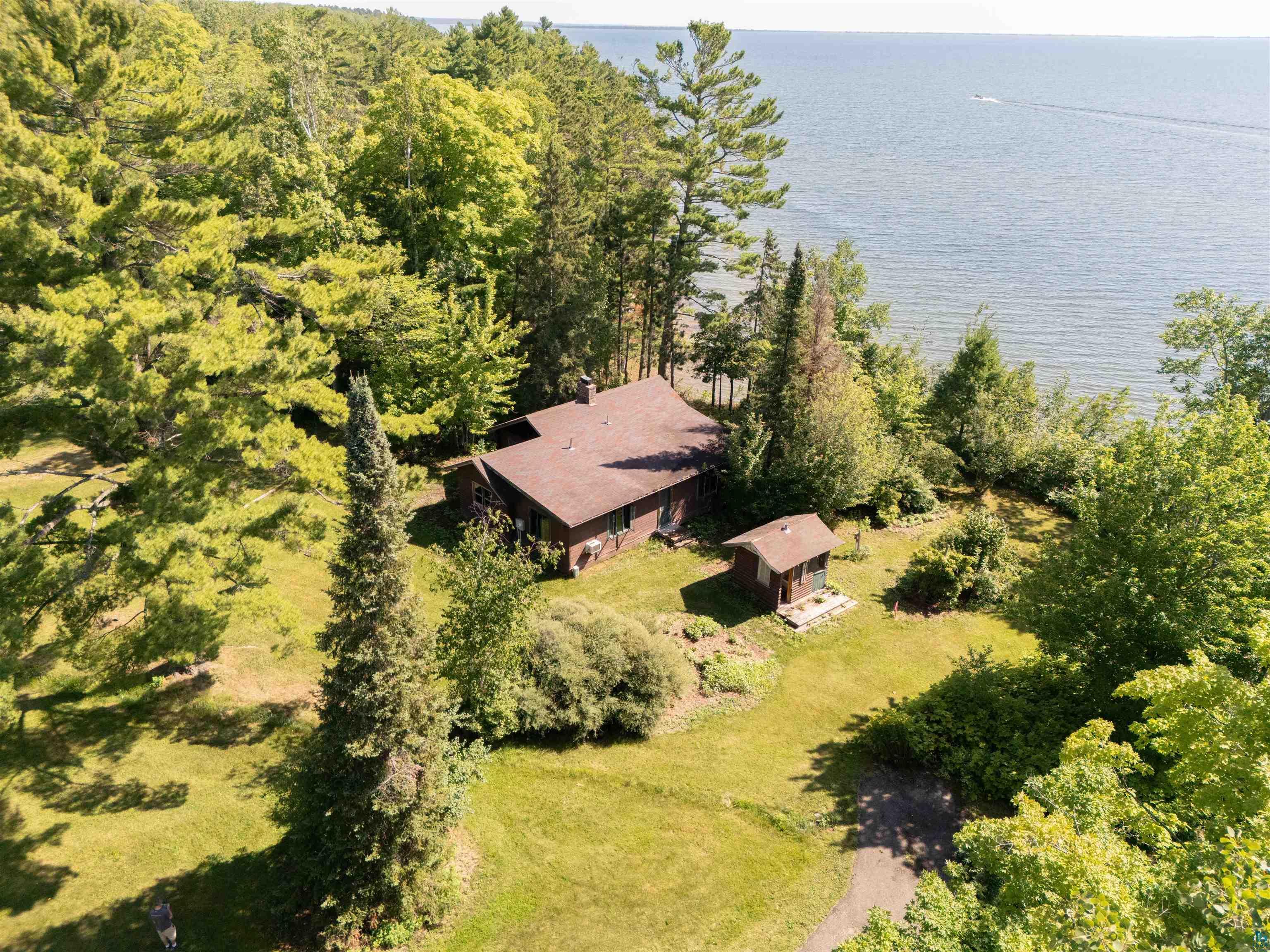 Image 0: Bird's eye view featuring Lake Superior frontage, Stunning Lake Superior Views!