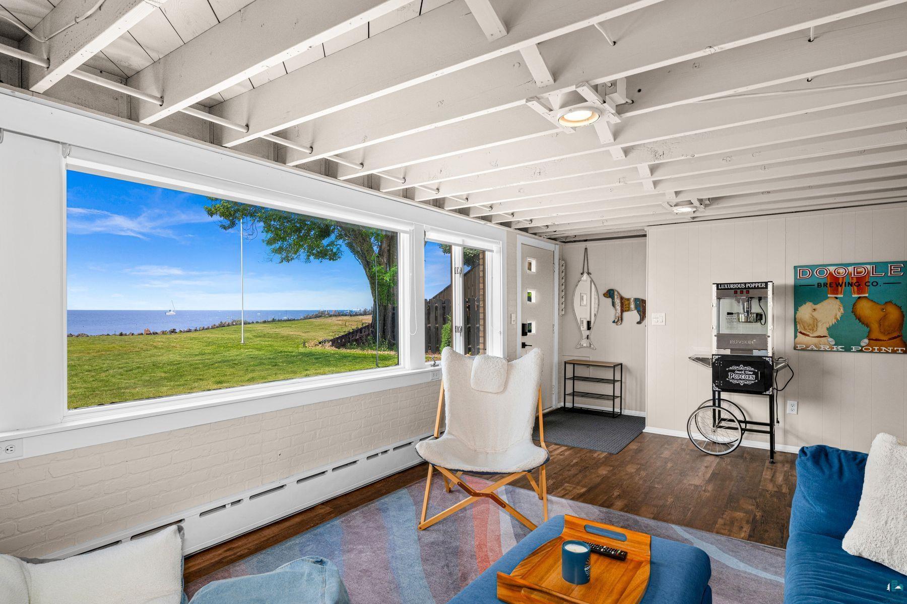 Image 2: Expansive picture windows showcasing panoramic water and landscape scenery, Living Room
