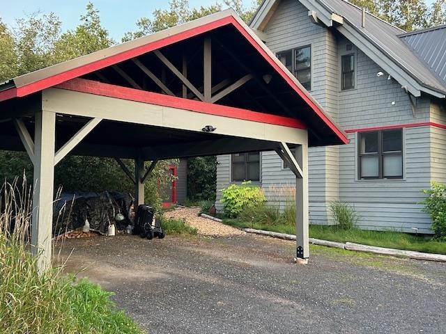 Image 3: View of vehicle parking featuring a carport, Parking