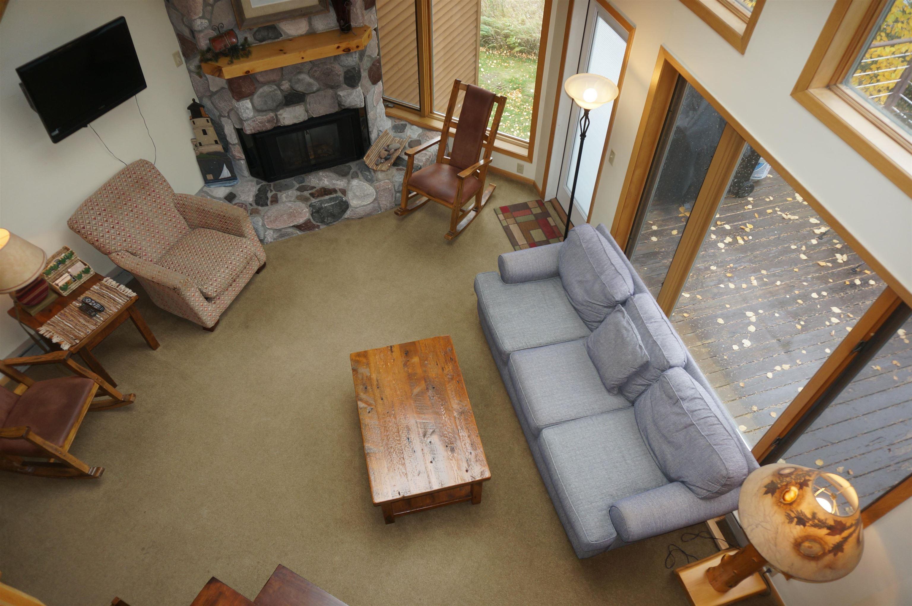 Image 3: Living room featuring a fireplace and carpet floors, Living Room