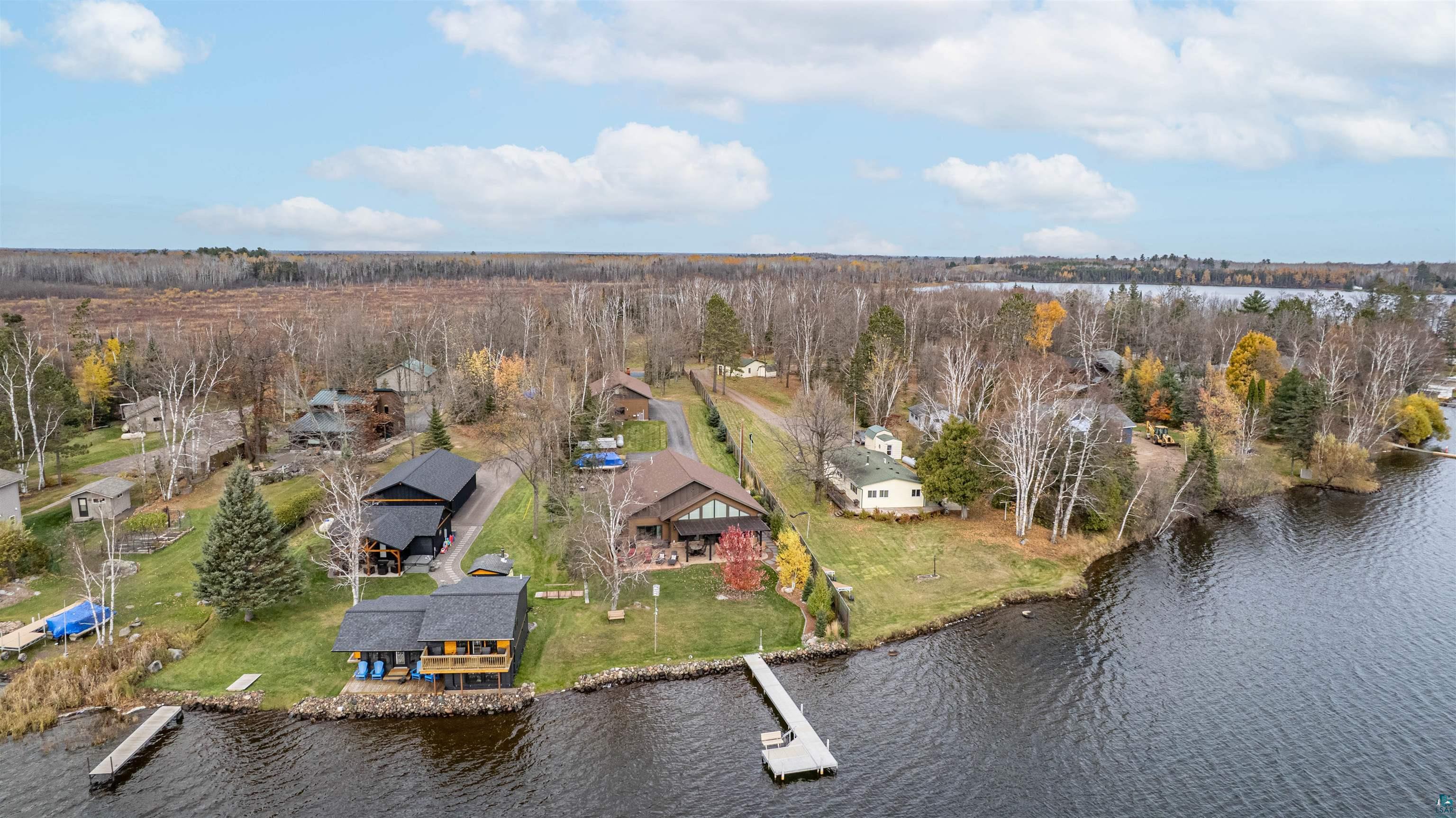 Image 3: Aerial perspective of suburban area with a large body of water, Aerial View