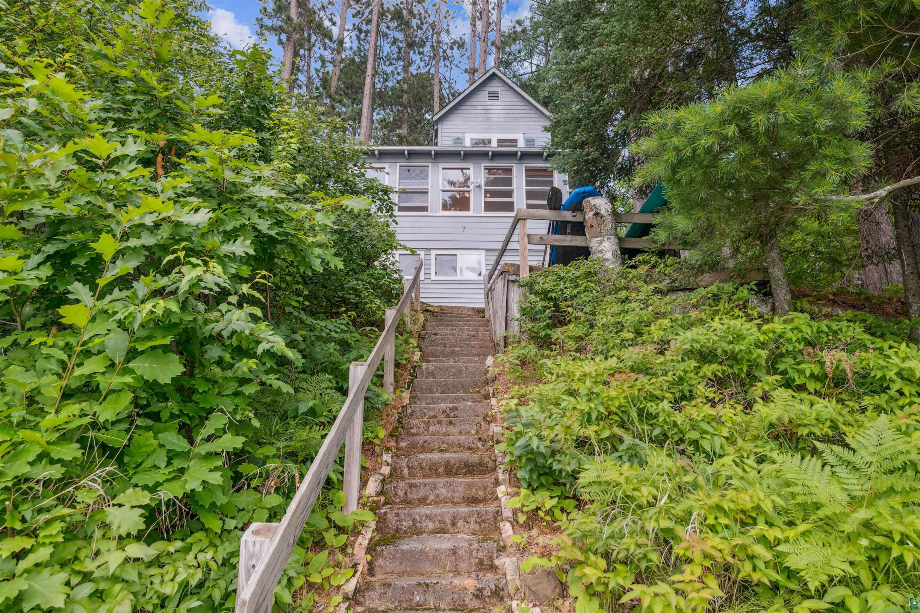 Image 2: Rear view of house featuring stairway, Back Of Structure